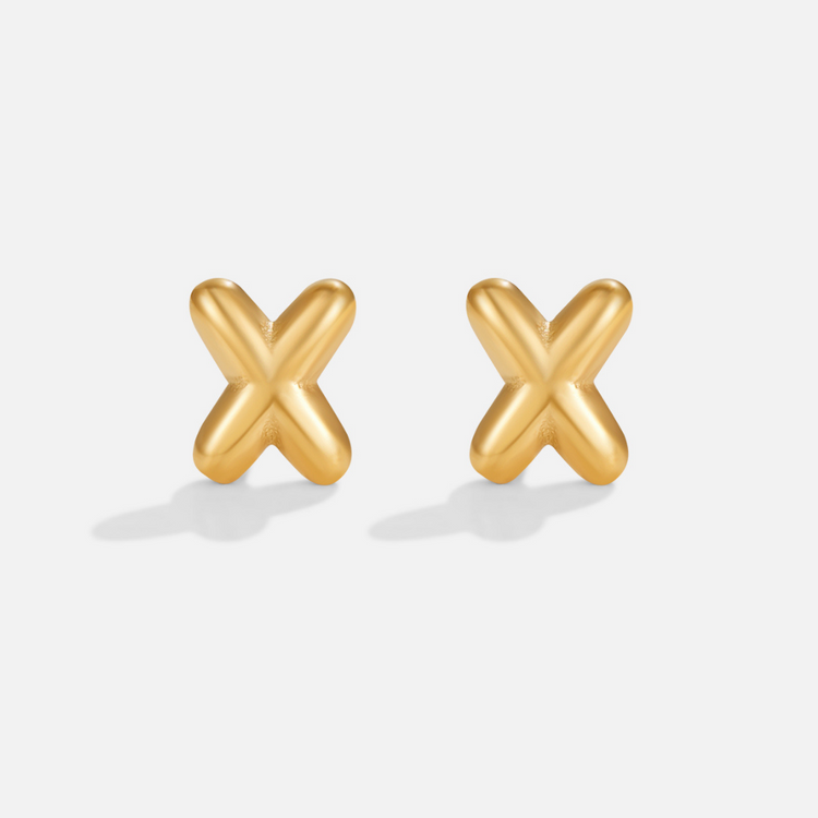Gold Bubble Letter Earrings, two gold X-shaped stud earrings on a plain light background