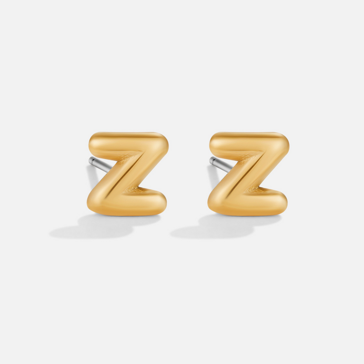 Gold Bubble Letter Earrings, pair of gold bubble letter Z stud earrings on a plain background