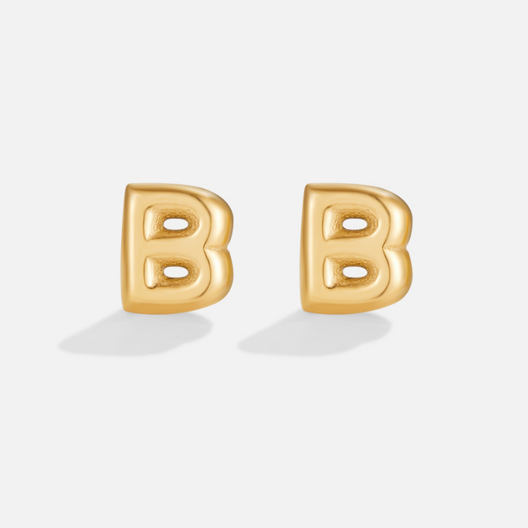 Gold Bubble Letter Earrings, pair of gold bubble-letter B stud earrings on a plain light background