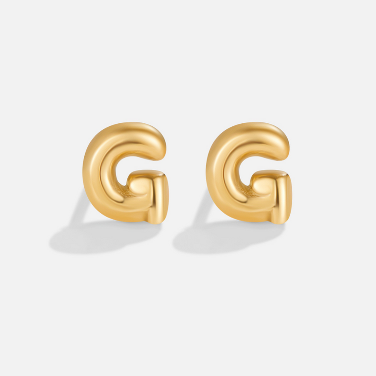 Gold Bubble Letter Earrings, pair of puffy gold letter G stud earrings on a plain white background
