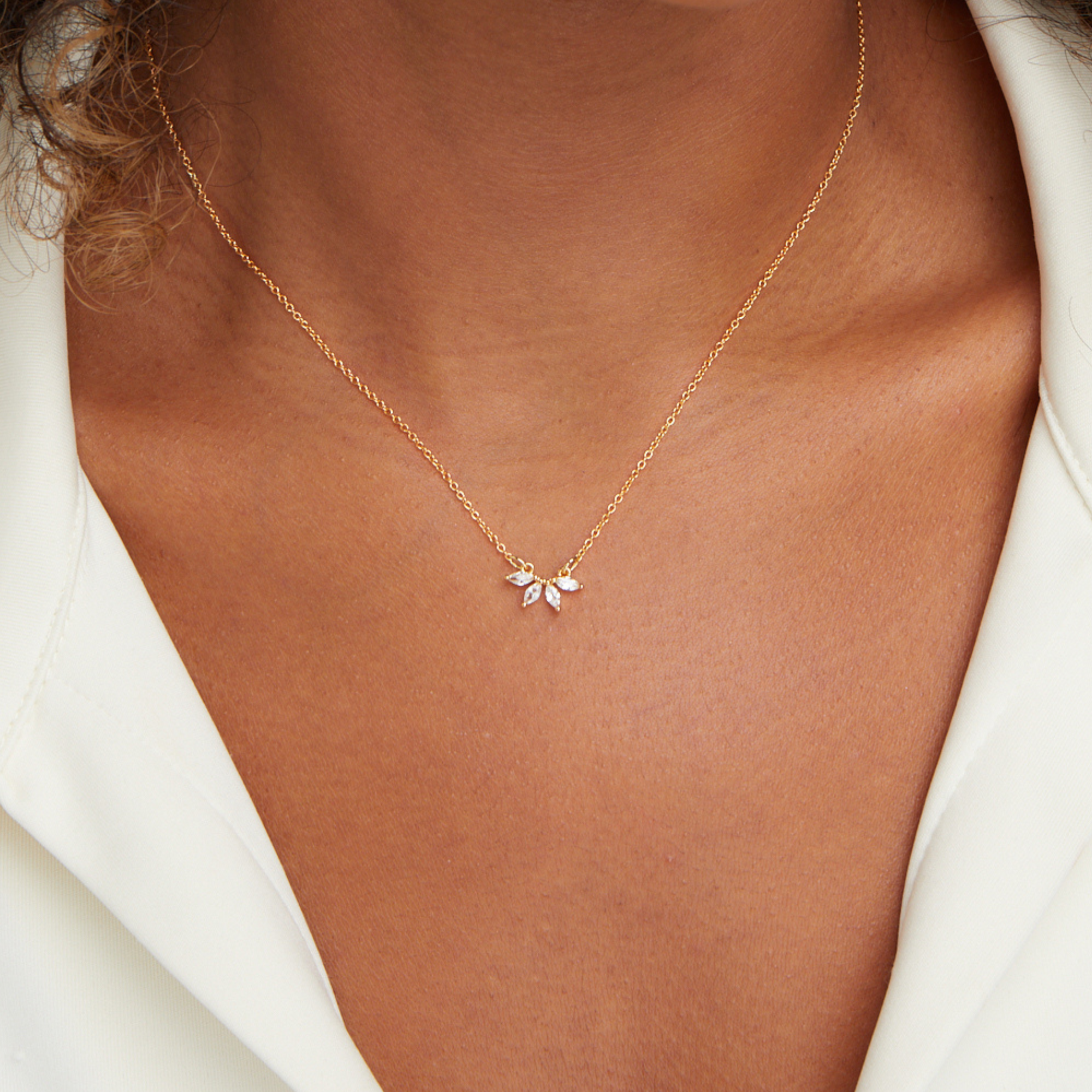 Tiffany Crystal Leaf Pendant Necklace, worn on a neck with a white open-collar shirt