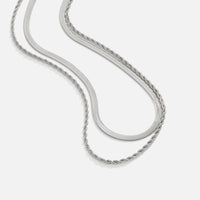 Alexandra Silver Layered Necklace, two silver chains laid out in a flowing curve on white