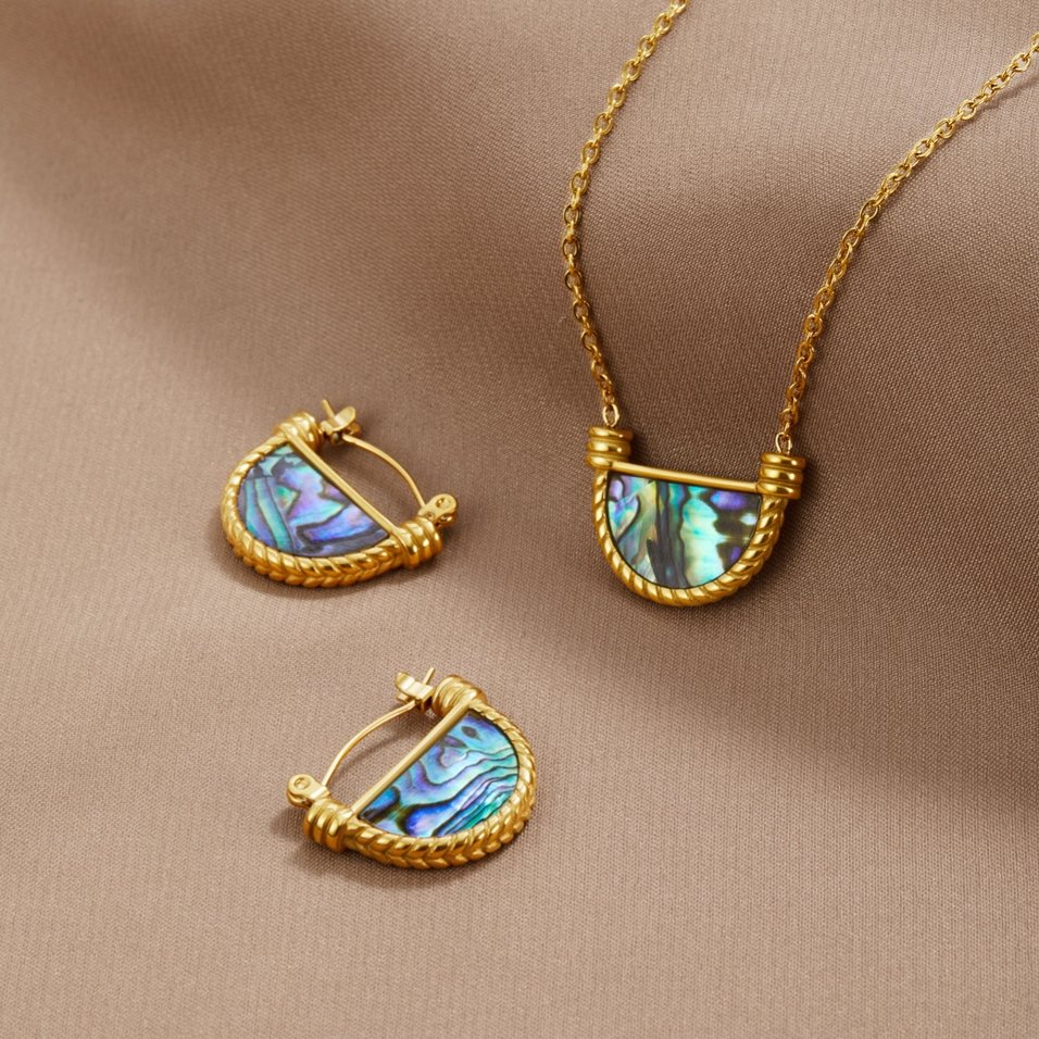 Amalfi Turquoise Shell Necklace, laid flat on beige satin with matching hoop earrings