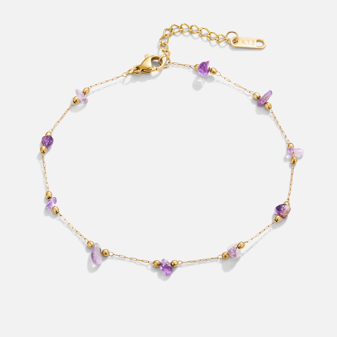Amethyst Stone Anklet, flat lay of a gold chain anklet with purple stone chips