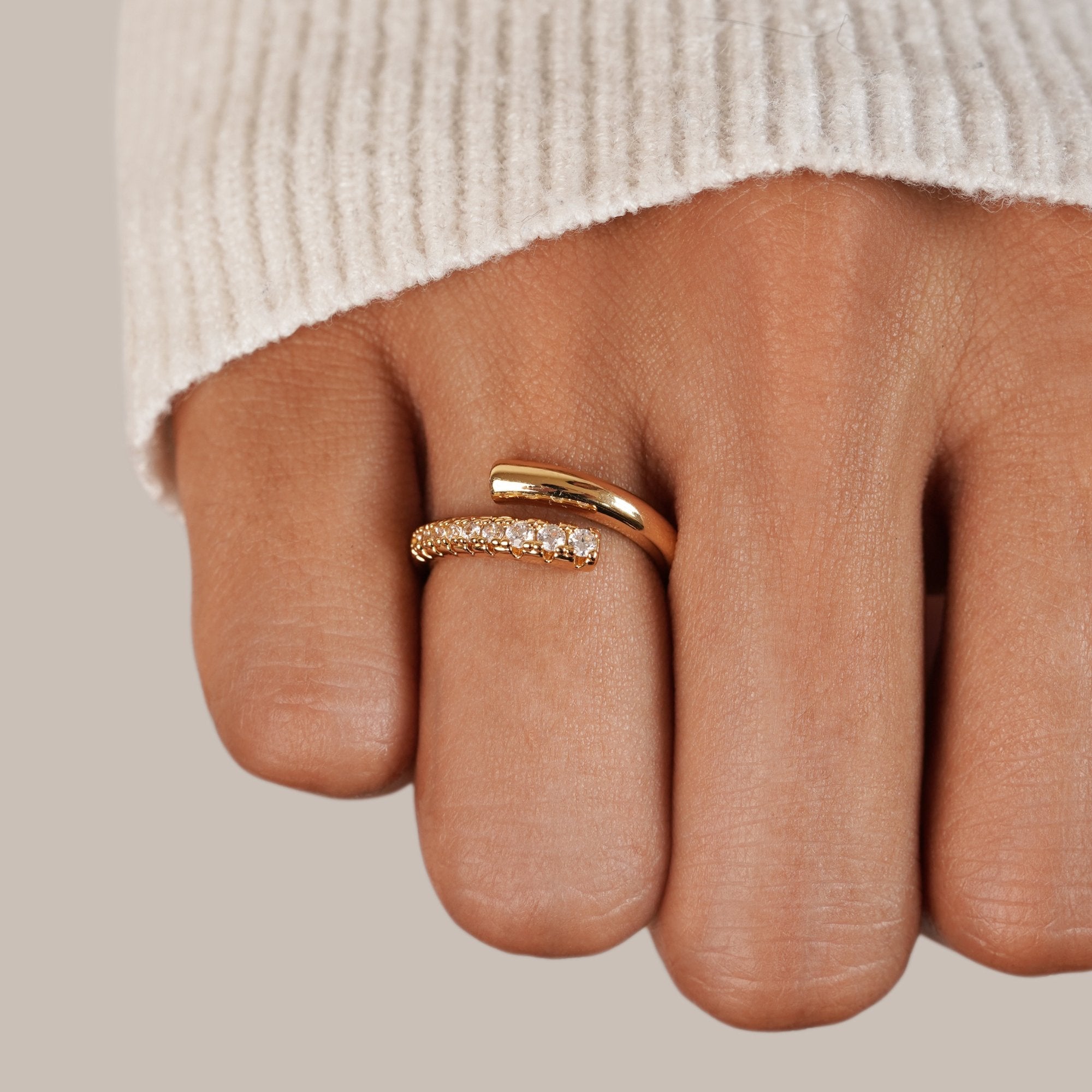 Arya Gold & Crystal Wrap Ring, worn on a finger, gold wrap ring with crystal pavé band