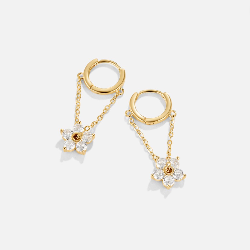 Blooming Petal Crystal Earrings, pair of gold hoops with chains dangling flower charms, on