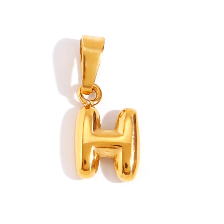 Bubble Letter Necklace, gold bubble-letter H pendant on a white background