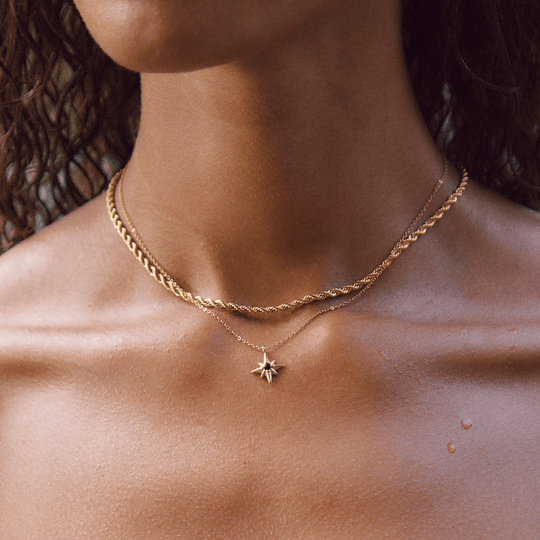 Free Calla Gold Twisted Chain Necklace, worn on a neck layered with a star pendant necklace
