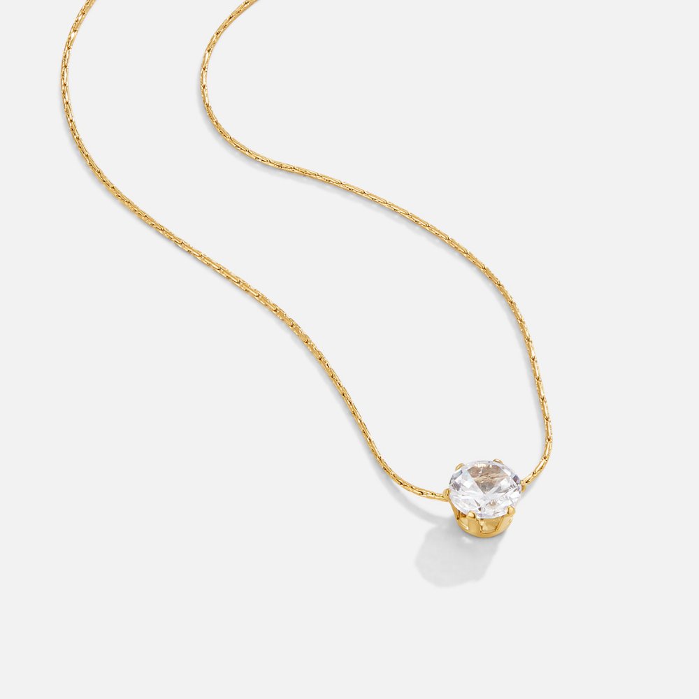 Dainty Round Crystal Necklace, gold chain necklace laid flat with a round clear crystal pendant