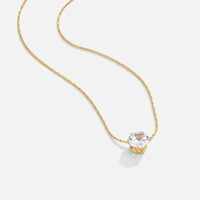 Dainty Round Crystal Necklace, gold chain necklace laid flat with a round clear crystal pendant