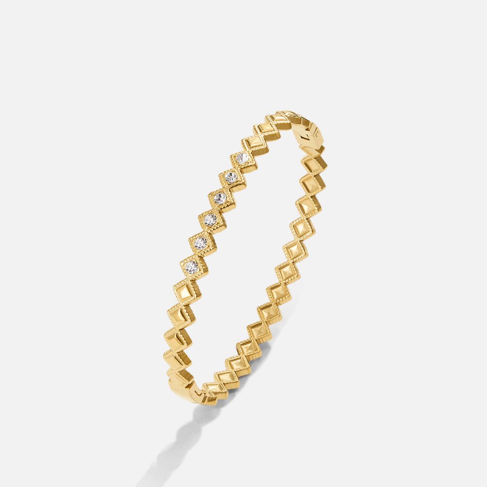 Elle Crystal Marquise Bangle, gold bangle with zigzag squares and small clear crystals, on white