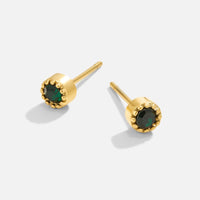 Emerald Green Stud Earrings, pair of gold stud earrings with dark green stones, on a plain
