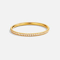 Eternity 18K Crystal Ring, gold band ring lying flat, with a row of clear stones across the front