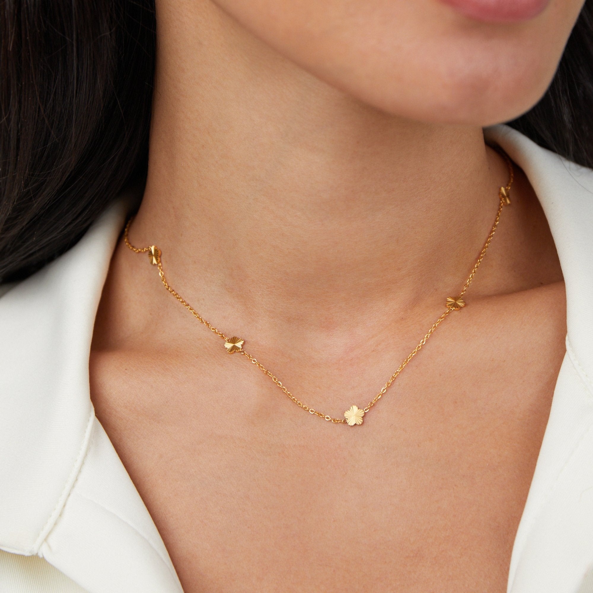 Flower Power 18K Gold Chain Necklace, worn on a neck with a white collared top, small gold