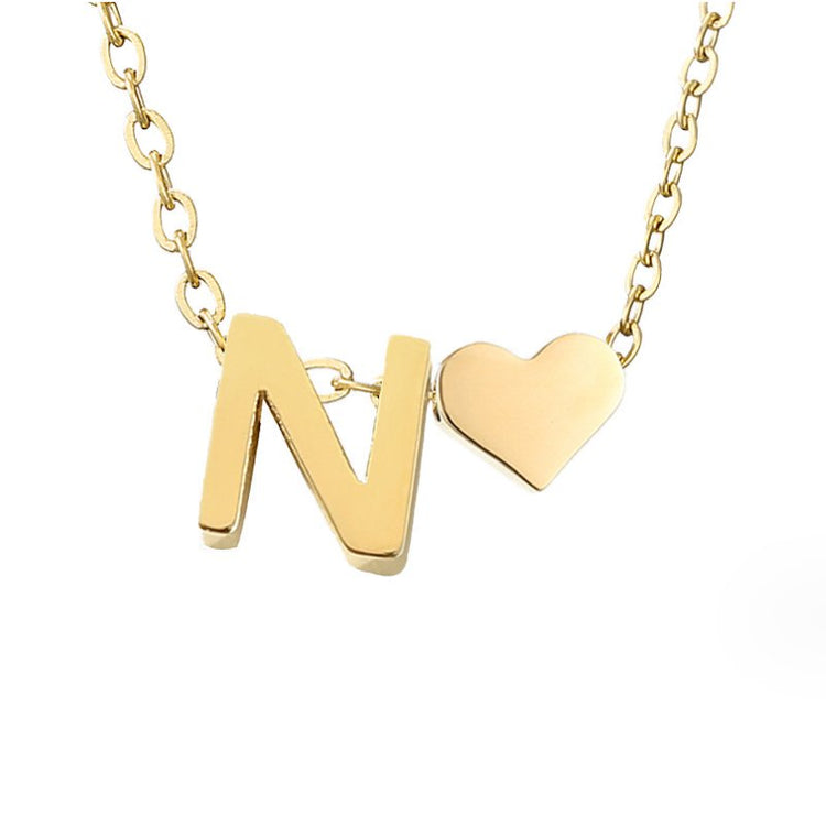 Forever Love & Letter Gold Necklace, gold letter N pendant beside a small gold heart on a chain
