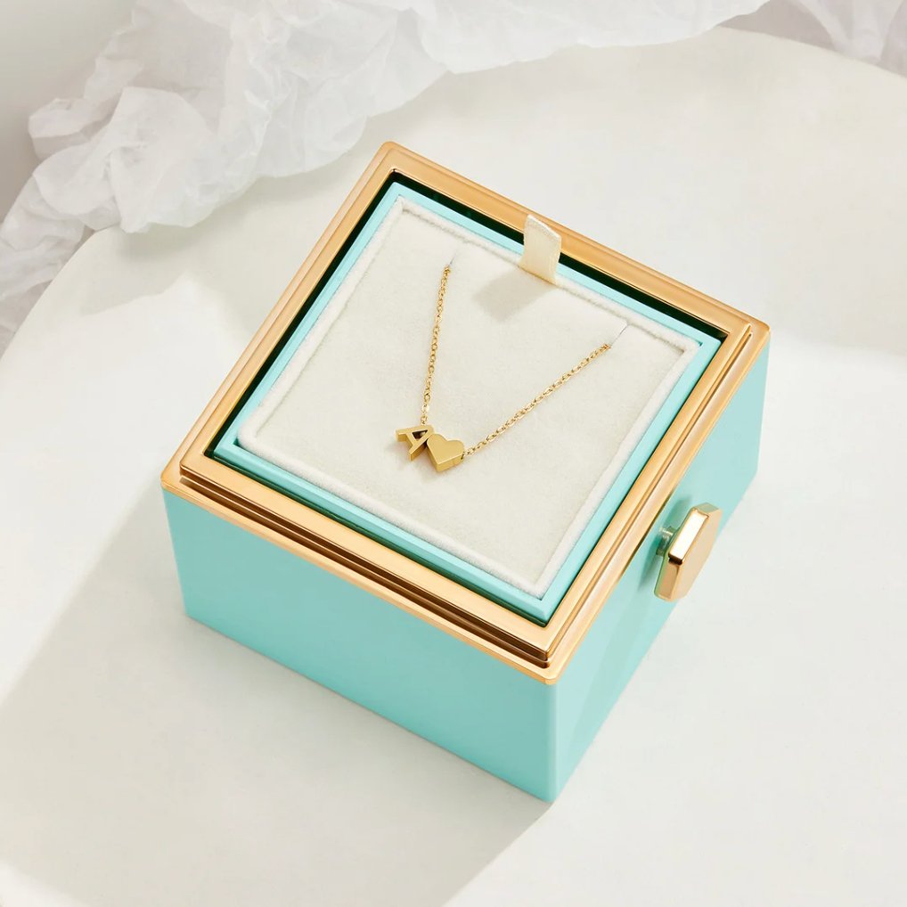 Forever Love & Letter Gold Necklace, gold necklace displayed in a turquoise box with cream