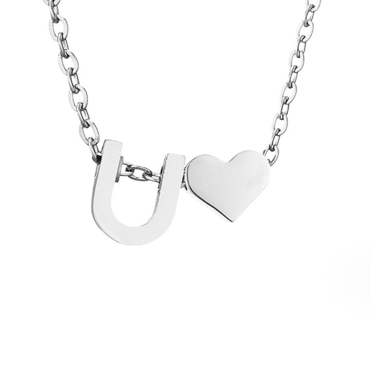 Forever Love & Letter Silver Necklace, close-up of a silver letter U charm beside a heart on a chain