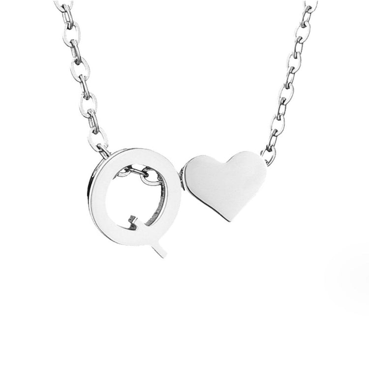 Forever Love & Letter Silver Necklace, close-up of a silver letter Q pendant and heart on a