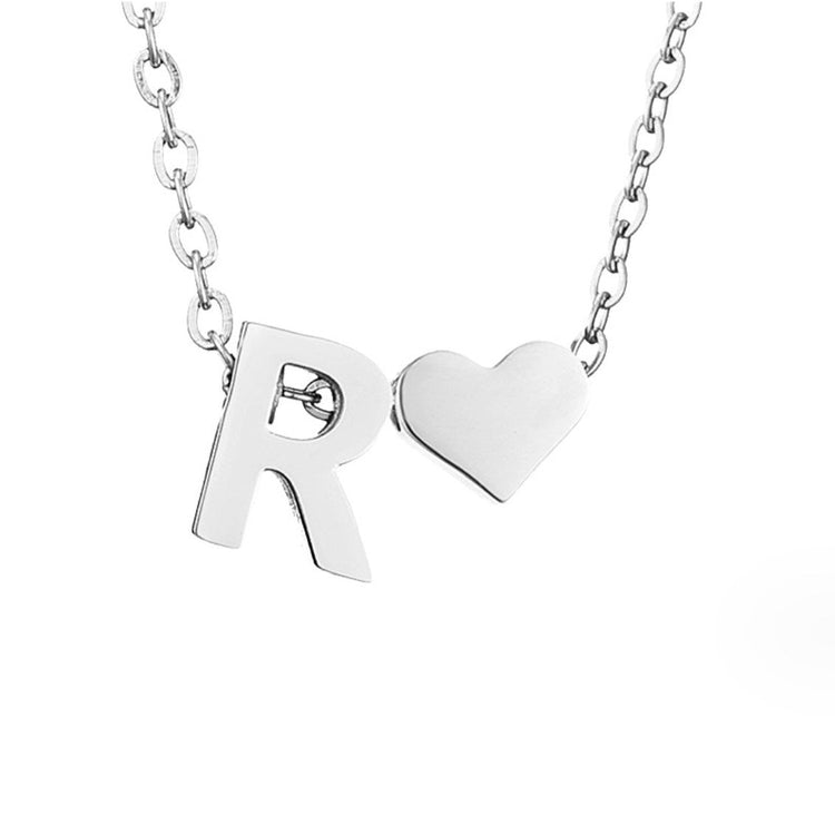 Forever Love & Letter Silver Necklace, close-up of a polished silver letter R and heart pendant on a chain