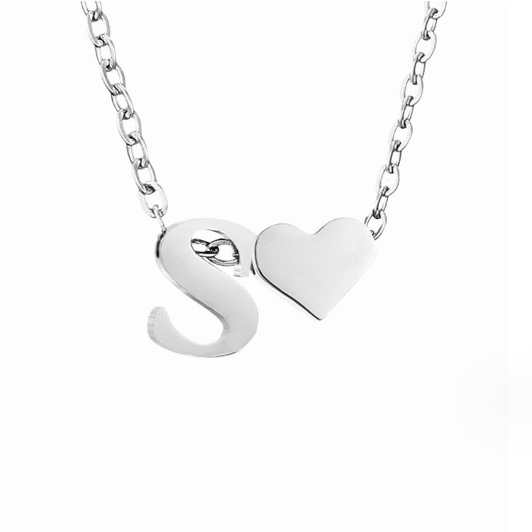 Forever Love & Letter Silver Necklace, close-up of a silver letter S pendant beside a heart on a chain