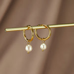 Freshwater Pearl Bella Hoop Earrings, pair of gold hoops with pearl drops, hung on a gold rod