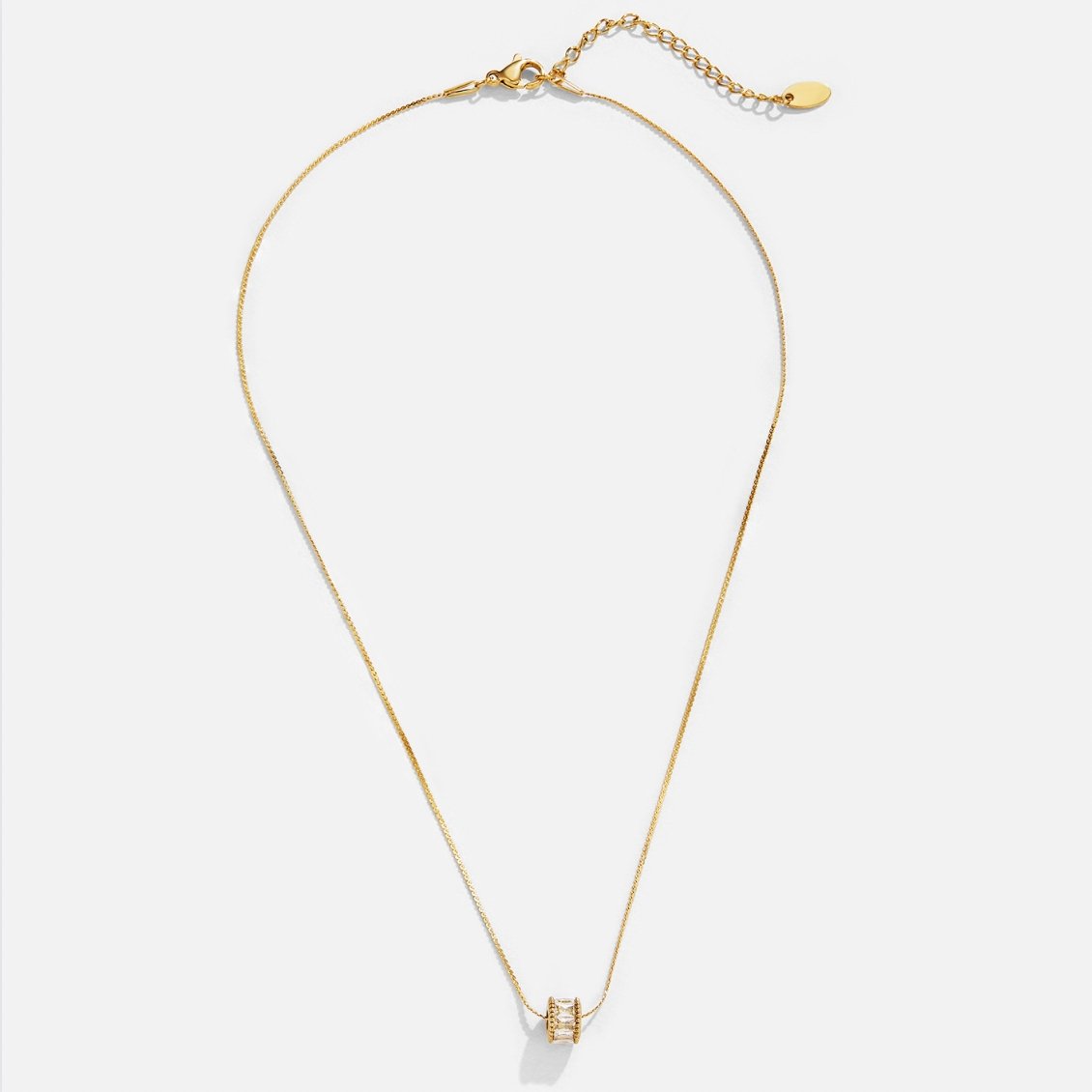 Gigi Crystal 18K Gold Necklace, gold chain laid flat with a small crystal barrel pendant