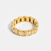 Gigi Square Crystal Ring, standing upright on white, gold band with rectangular clear stones