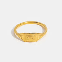 Gold Adaline Ring, gold ring on white background with engraved geometric face