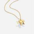 Gold Elephant Necklace, gold elephant pendant on a fine link chain, against white