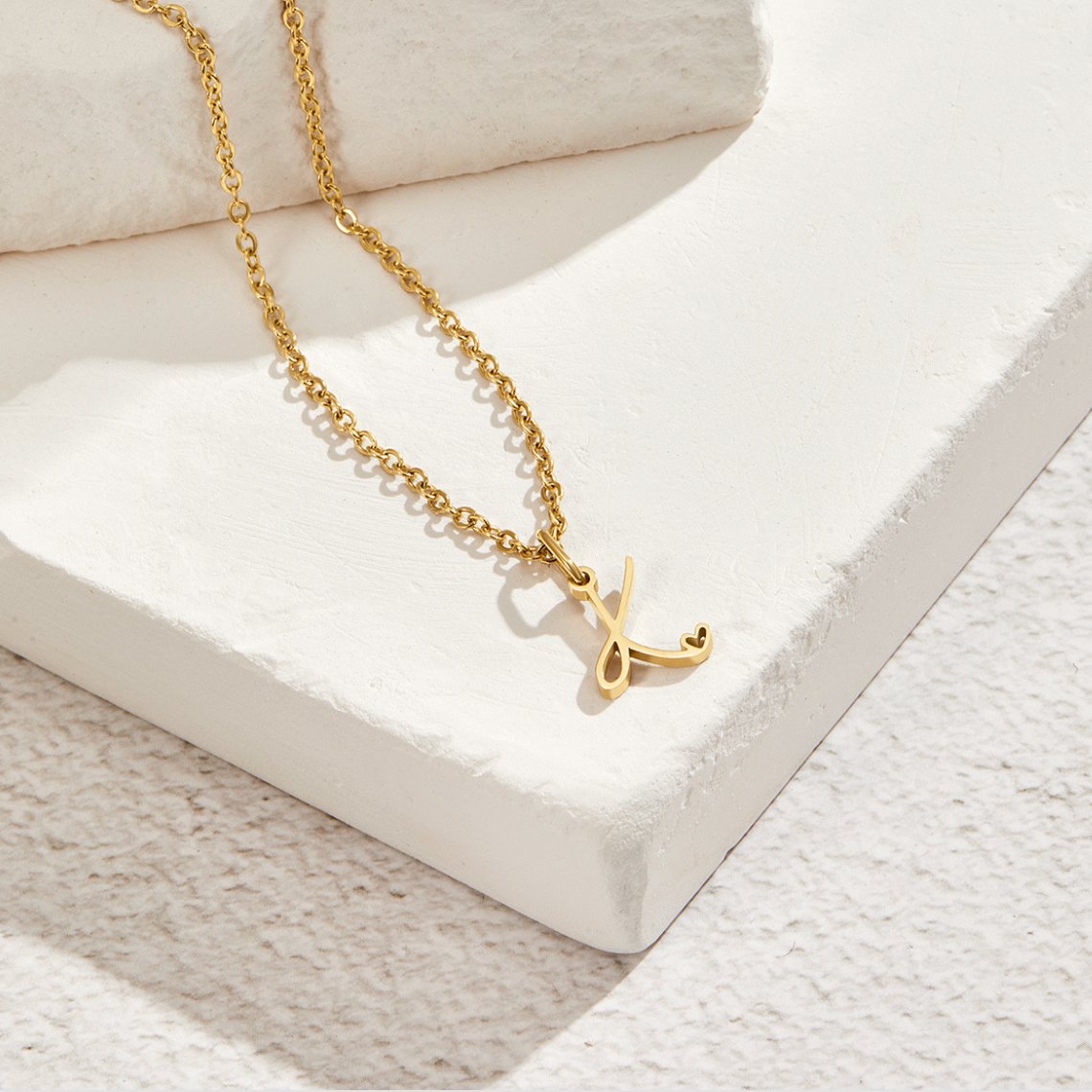 Gold Letter Heart Necklace, gold chain necklace with a script letter pendant on white stone