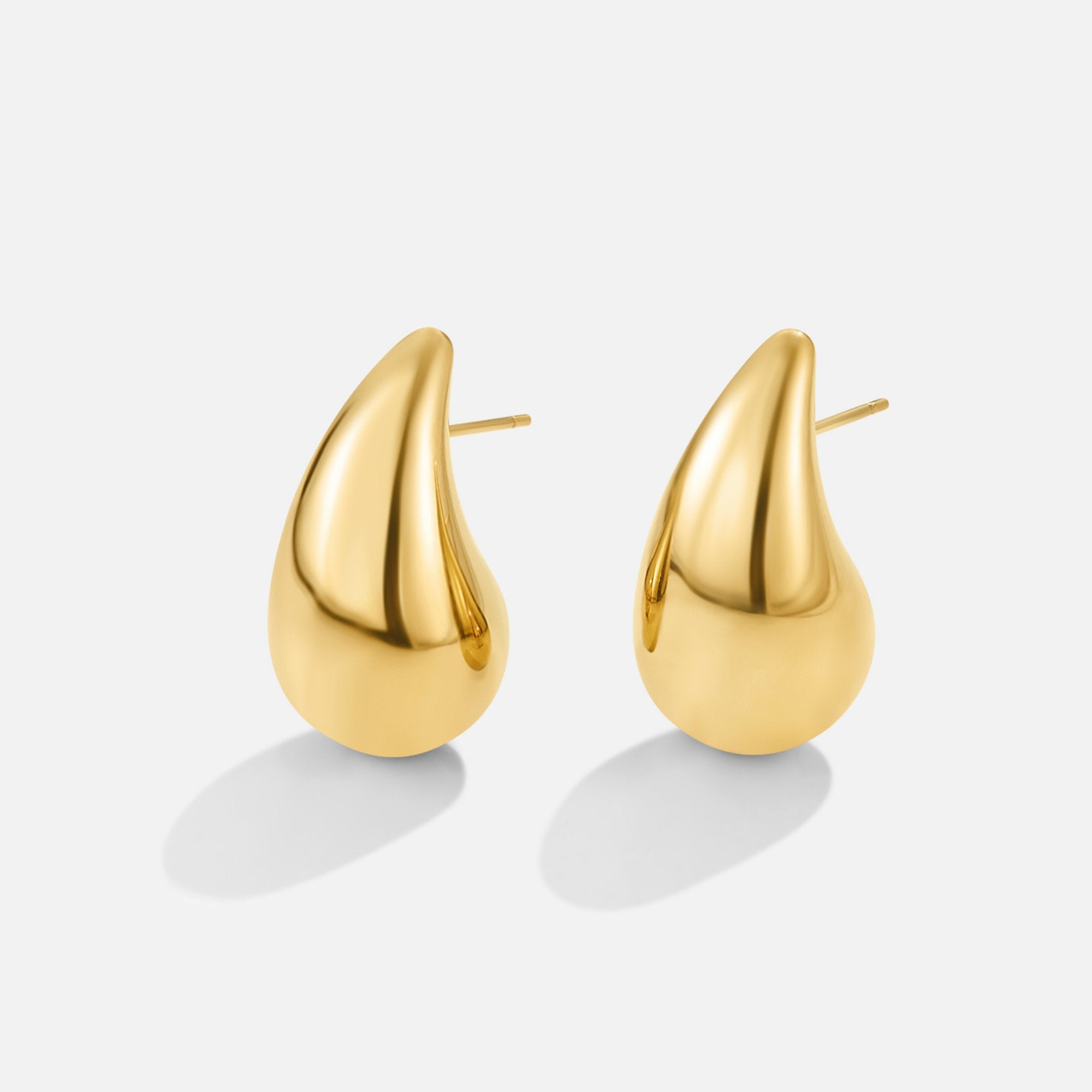 Amara Gold Teardrop Earrings, pair of polished gold teardrop stud earrings on white background