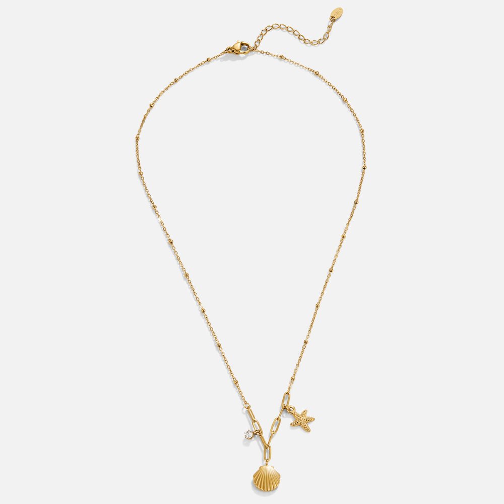 Golden Seashell & Starfish Necklace, flat lay of gold necklace with shell and starfish charms