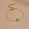 Green Emerald Crystal Bracelet, laid flat on beige satin, green stone with diamond-set halo