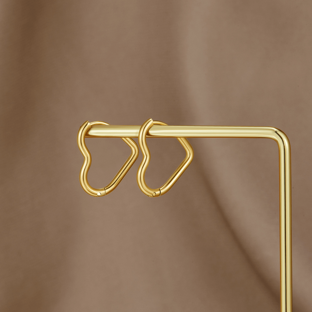 Heart Gold Hoops, two gold heart-shaped hoops hung on a gold display rod