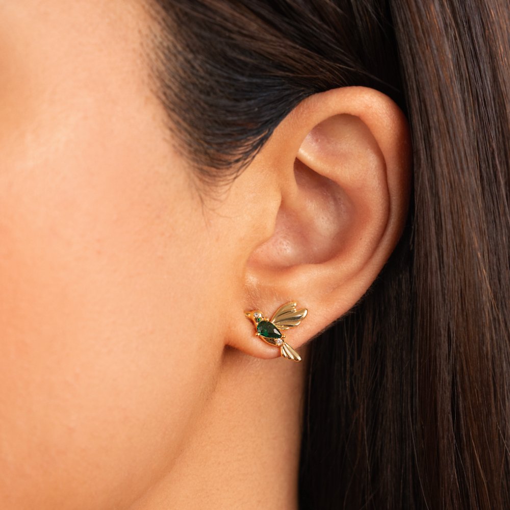 Hummingbird Stud Earrings, worn on an ear, close-up with a green stone body