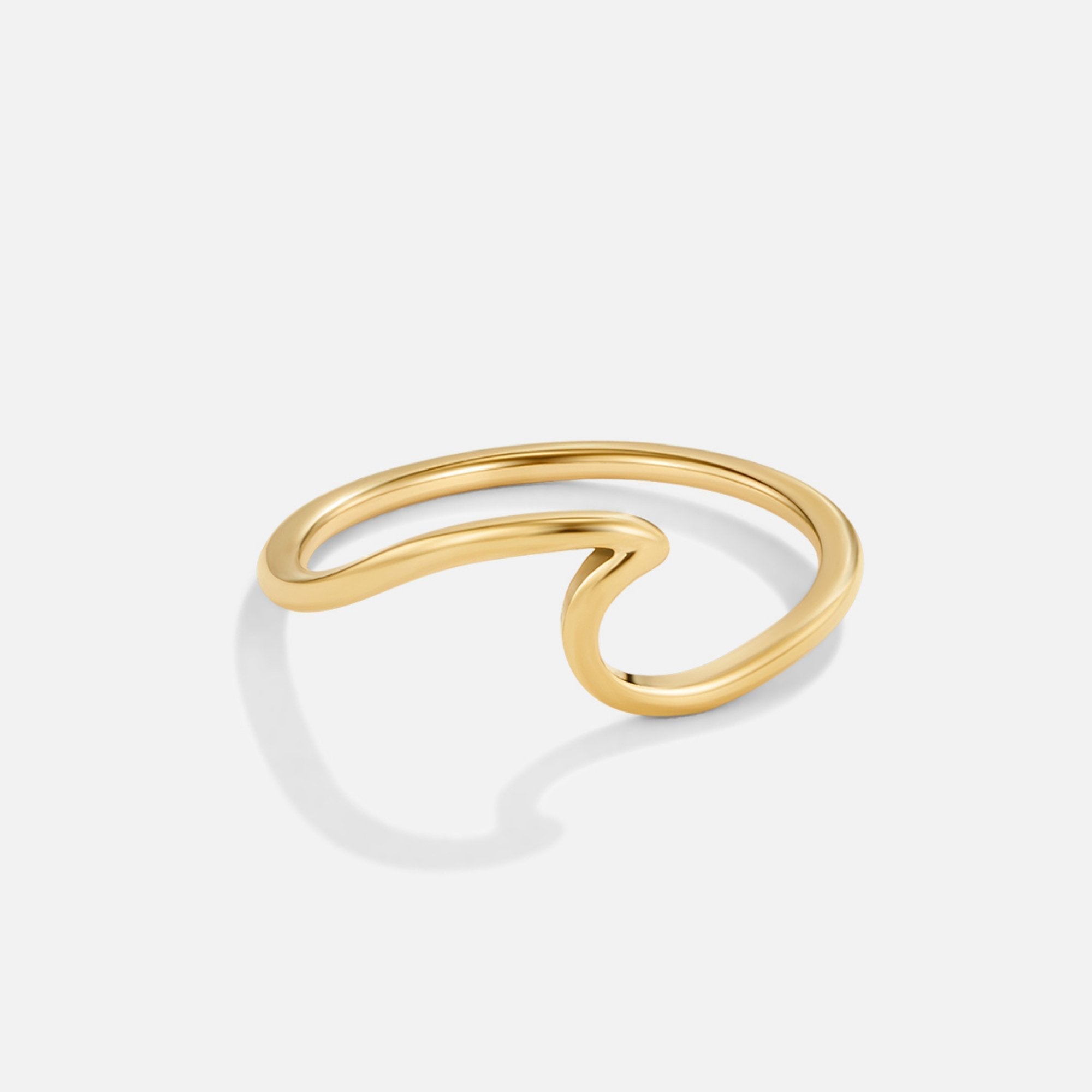 Imari Gold Wave Ring, polished gold ring with a wave-shaped band on white