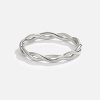 Infinity 18K Silver Twist Ring, standing alone on white background, polished twisted silver band