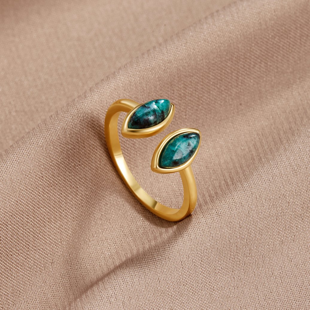 Jade Green Wrap Ring, open gold ring with two marquise green stones on satin fabric