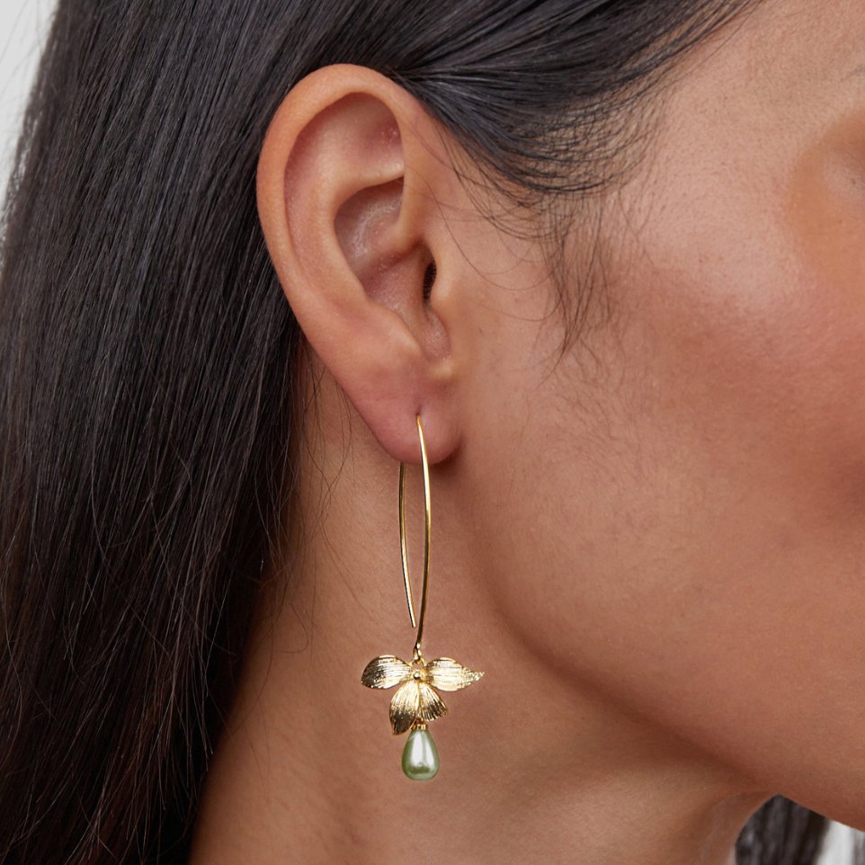 Jade Pearl & Petal Drop Earrings, worn on an ear, gold flower with green pearl drop