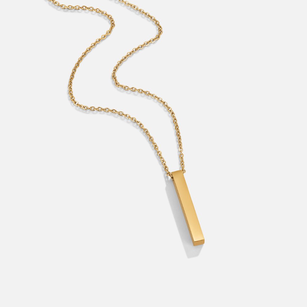 Lala Gold Bar Necklace, flat-lay of a gold chain with a polished vertical bar pendant on white