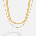 Layla 18K Gold Layered Necklace, two gold chains layered on a white background, one wide and