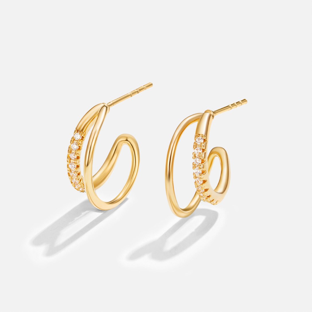 Leyla Crystal Double Hoop Earrings, pair of gold hoops with pavé crystals on a plain background