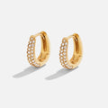 Lily Crystal Hoop Earrings, a pair of gold hoops with a crystal-set outer edge, on white