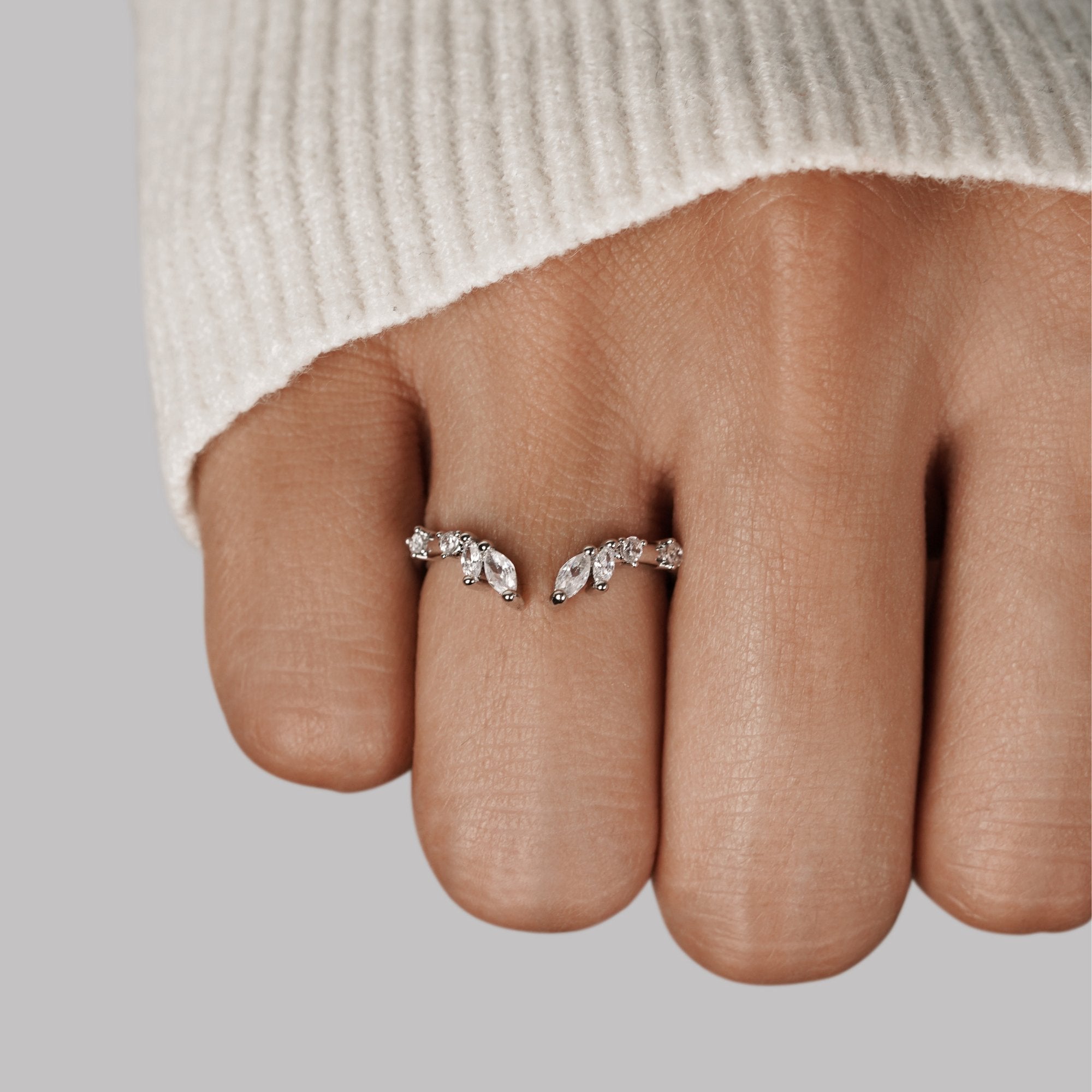 Lily Crystal Silver Vine Ring, worn on a finger with a cream knit sleeve behind it