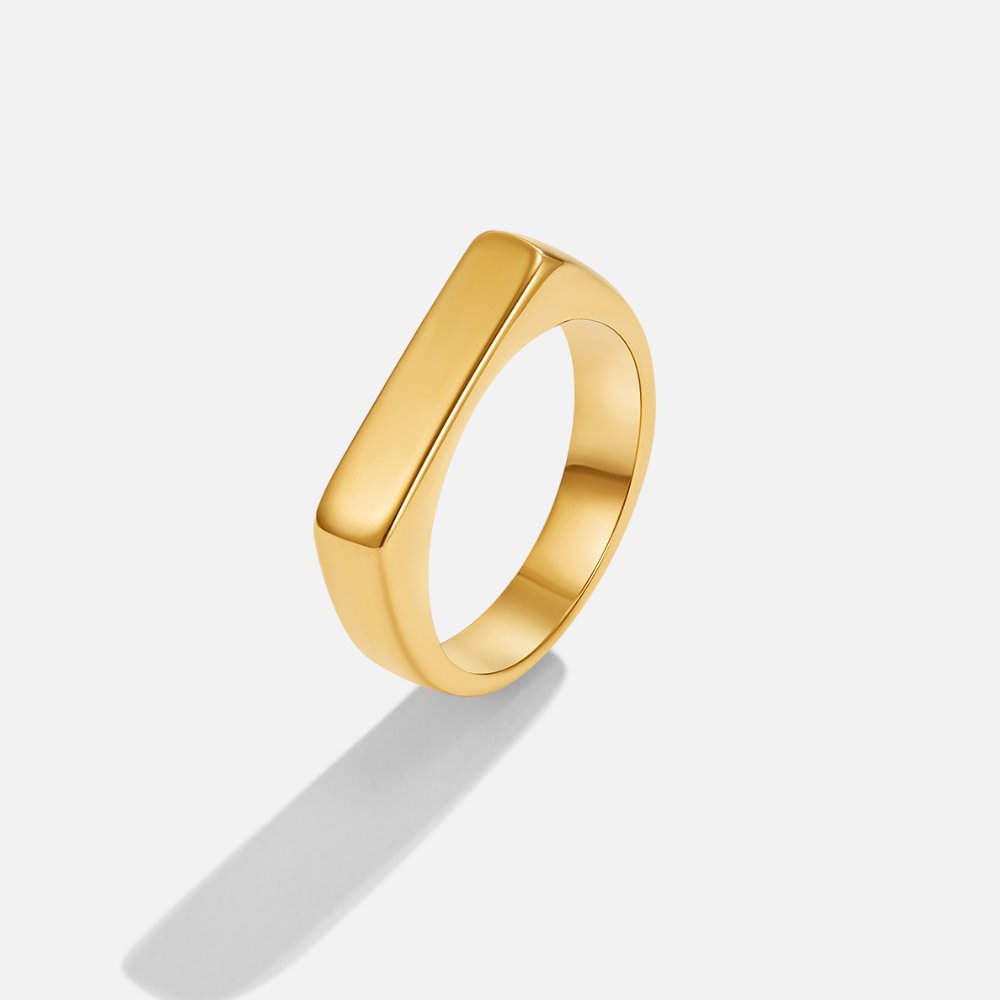 Lola Bar Signet Ring, gold ring with a flat, wide top bar on a plain background