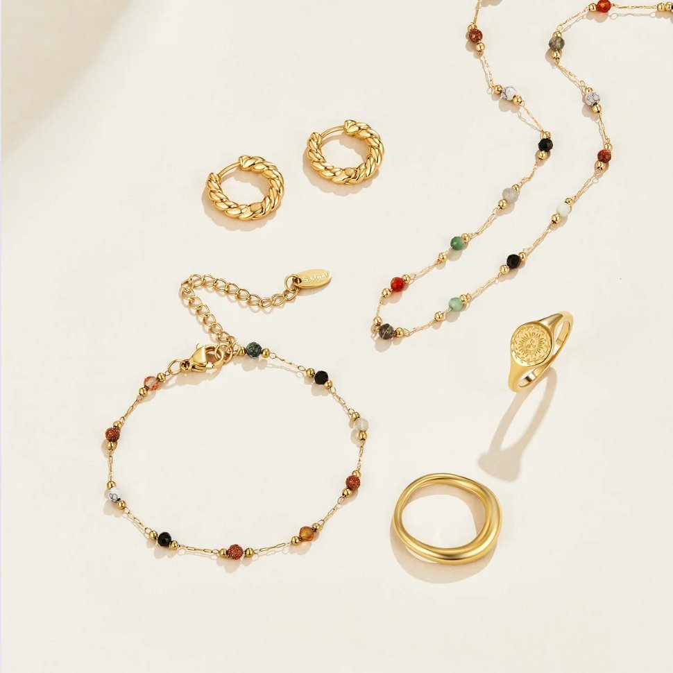 Lulu Beaded Stone Necklace, flat lay of gold hoop earrings, bracelet, necklace and two rings