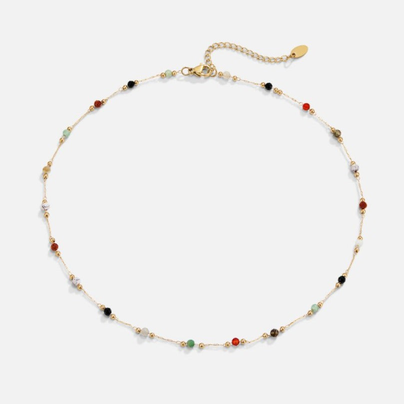 Lulu Beaded Stone Necklace, laid flat on white, fine gold chain with small coloured stone beads