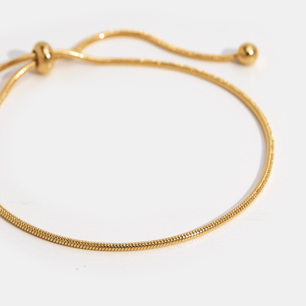 Madison Gold Chain Bracelet, gold snake-chain bracelet on white with adjustable sliding clasp