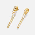 Mara Crystal Chain Earrings, pair of gold stud earrings with dangling chains on white