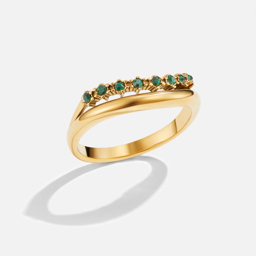 Marissa Emerald Green Layered Ring, single gold ring with a row of green stones, on white